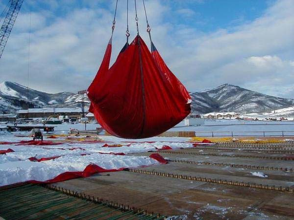 Snow tarp lifting snow on a jobsite